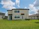 Spacious backyard featuring a lush green lawn and views of neighboring homes at 38120 Shale Stone Ct, Zephyrhills, FL 33540