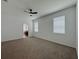Bedroom with carpet, plenty of natural light, and access to an en-suite bathroom at 38120 Shale Stone Ct, Zephyrhills, FL 33540