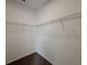 Walk-in closet with wire shelving providing ample storage space at 38120 Shale Stone Ct, Zephyrhills, FL 33540