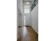 Bright foyer with wood-look tile flooring, high ceilings, and a large window above the front door at 38120 Shale Stone Ct, Zephyrhills, FL 33540