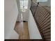 Bright foyer with wood-look tile flooring, high ceilings, chandelier, and staircase at 38120 Shale Stone Ct, Zephyrhills, FL 33540
