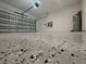 A spacious garage with an epoxy floor, offering a clean and durable surface for parking and storage at 38120 Shale Stone Ct, Zephyrhills, FL 33540