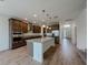 Modern kitchen featuring a center island, stainless steel appliances, and granite countertops at 38120 Shale Stone Ct, Zephyrhills, FL 33540