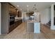 Modern kitchen with stainless steel appliances, granite countertops, and a spacious island at 38120 Shale Stone Ct, Zephyrhills, FL 33540