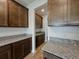 Kitchen with granite countertops and ample cabinet space, showcasing modern design at 38120 Shale Stone Ct, Zephyrhills, FL 33540