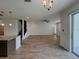 Spacious living room with tile floors, open floor plan, and granite countertop at 38120 Shale Stone Ct, Zephyrhills, FL 33540