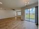 Open floor plan features tile floors and sliding glass doors to backyard at 38120 Shale Stone Ct, Zephyrhills, FL 33540