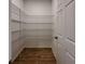 Walk-in pantry featuring ample shelving space for organized storage at 38120 Shale Stone Ct, Zephyrhills, FL 33540