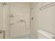 Shower and toilet room with tiled walls and flooring at 399 Walnut Ct, Palm Harbor, FL 34683
