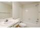 Bathroom with vanity, toilet, tub and shower with tile surround at 399 Walnut Ct, Palm Harbor, FL 34683