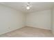Spacious bedroom featuring a ceiling fan and carpeted flooring at 399 Walnut Ct, Palm Harbor, FL 34683