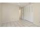 Bedroom with ceiling fan, tile floor and closet with louvered doors at 399 Walnut Ct, Palm Harbor, FL 34683