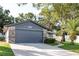 Charming home with a well-maintained lawn, stone accents, and a spacious driveway at 399 Walnut Ct, Palm Harbor, FL 34683