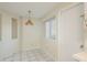 Eat-in kitchen featuring a hanging ceiling light fixture and tiled flooring at 399 Walnut Ct, Palm Harbor, FL 34683