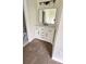 Updated bathroom featuring a modern vanity with marble countertop, sleek black hardware, and contemporary lighting at 4003 Oak Limb Ct, Tampa, FL 33614
