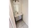 Bathroom vanity with a white sink, gray cabinet, and a large mirror at 4003 Oak Limb Ct, Tampa, FL 33614