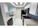 Galley kitchen featuring bright white cabinets and black appliances at 4003 Oak Limb Ct, Tampa, FL 33614