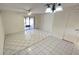 Bright and airy living room with tile flooring and sliding glass doors leading to the outdoor patio at 4003 Oak Limb Ct, Tampa, FL 33614