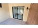 Covered patio with tile flooring and outdoor lighting, adjacent to a door at 4003 Oak Limb Ct, Tampa, FL 33614