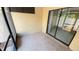 Tiled patio space with sliding glass doors to let in natural light at 4003 Oak Limb Ct, Tampa, FL 33614