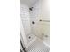 Walk-in shower featuring white subway tiles, hexagon tile floor, and modern fixtures at 4003 Oak Limb Ct, Tampa, FL 33614