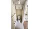 Small powder room with hexagon tile flooring and a white toilet, plus a cabinet for added storage space at 4003 Oak Limb Ct, Tampa, FL 33614