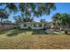 Lush backyard with mature trees, providing ample shade and a serene setting for relaxation and recreation at 4210 Huntington Ne St, St Petersburg, FL 33703