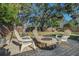 Charming backyard featuring a cozy fire pit area with chairs, perfect for outdoor entertaining at 4210 Huntington Ne St, St Petersburg, FL 33703