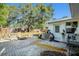 Cozy backyard patio with inviting seating area and lush greenery, perfect for outdoor entertaining at 4210 Huntington Ne St, St Petersburg, FL 33703