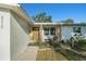 Charming front exterior with inviting porch, featuring tasteful landscaping and a welcoming entrance at 4210 Huntington Ne St, St Petersburg, FL 33703