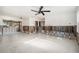 Large living room with terrazzo floors, ceiling fan and lots of natural light at 4210 Huntington Ne St, St Petersburg, FL 33703