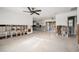 Spacious living room featuring terrazzo floors, a modern ceiling fan and open layout at 4210 Huntington Ne St, St Petersburg, FL 33703