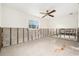 Bright living room featuring lots of natural light and ceiling fan; ready for your vision at 4210 Huntington Ne St, St Petersburg, FL 33703