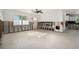Bright living room with terrazzo floors and large windows for plenty of natural light at 4210 Huntington Ne St, St Petersburg, FL 33703