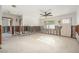 Bright, spacious living room with terrazzo floors and a modern ceiling fan at 4210 Huntington Ne St, St Petersburg, FL 33703