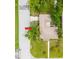 Overhead view of a well-maintained house with a beautiful lawn, trees and paved driveway on a sunny day at 4300 16Th N Ave, St Petersburg, FL 33713