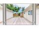 View of the fenced-in back patio, showcasing the wooden decking and the access to the yard at 4300 16Th N Ave, St Petersburg, FL 33713