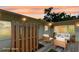 This back patio offers a wooden floor and a seating arrangement ready for relaxation and outdoor enjoyment at 4300 16Th N Ave, St Petersburg, FL 33713