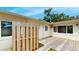 Wooden back patio with a fan offers a spot to relax and enjoy the outdoor with natural light at 4300 16Th N Ave, St Petersburg, FL 33713