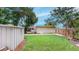 Backyard featuring lush green grass and an additional storage shed for extra storage at 4300 16Th N Ave, St Petersburg, FL 33713