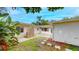 The backyard features a wooden deck and lush greenery, creating an inviting outdoor living space at 4300 16Th N Ave, St Petersburg, FL 33713