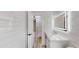 Modern bathroom with white tile, vanity with marble countertop, and illuminated mirror at 4300 16Th N Ave, St Petersburg, FL 33713