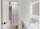 Bright bathroom with white subway tile, modern vanity, and LED mirror at 4300 16Th N Ave, St Petersburg, FL 33713
