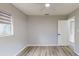 Bright bedroom features wood-look flooring, modern window, and a ceiling fan at 4300 16Th N Ave, St Petersburg, FL 33713