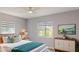 Bright bedroom showcases two windows, neutral walls, a ceiling fan, and staging for a fresh feel at 4300 16Th N Ave, St Petersburg, FL 33713