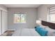 Staged bedroom features stylish decor, natural light, and serene backyard view at 4300 16Th N Ave, St Petersburg, FL 33713