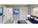 This staged bedroom offers ample closet space, modern decor, and neutral walls at 4300 16Th N Ave, St Petersburg, FL 33713