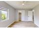 The bedroom features wood-look flooring, closet, and modern window, creating a comfortable living space at 4300 16Th N Ave, St Petersburg, FL 33713