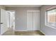 Bright bedroom features wood-look floors, neutral walls, a closet, and modern window at 4300 16Th N Ave, St Petersburg, FL 33713