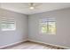 This bedroom features neutral walls, modern windows, and wood-look flooring for a bright and airy feel at 4300 16Th N Ave, St Petersburg, FL 33713